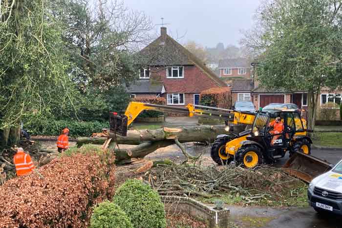 Men with JCB clearing the road