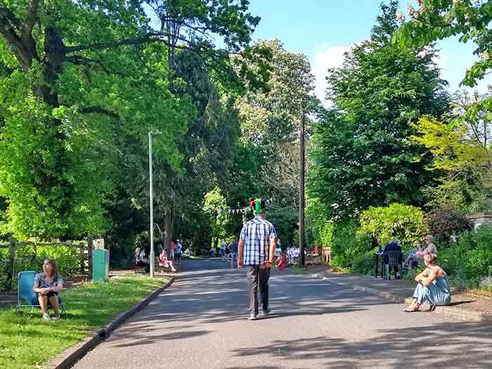 View down the drive, person walking away