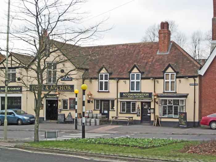 pub with white facing, green area in front